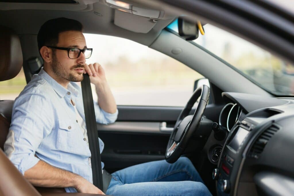 man inside car