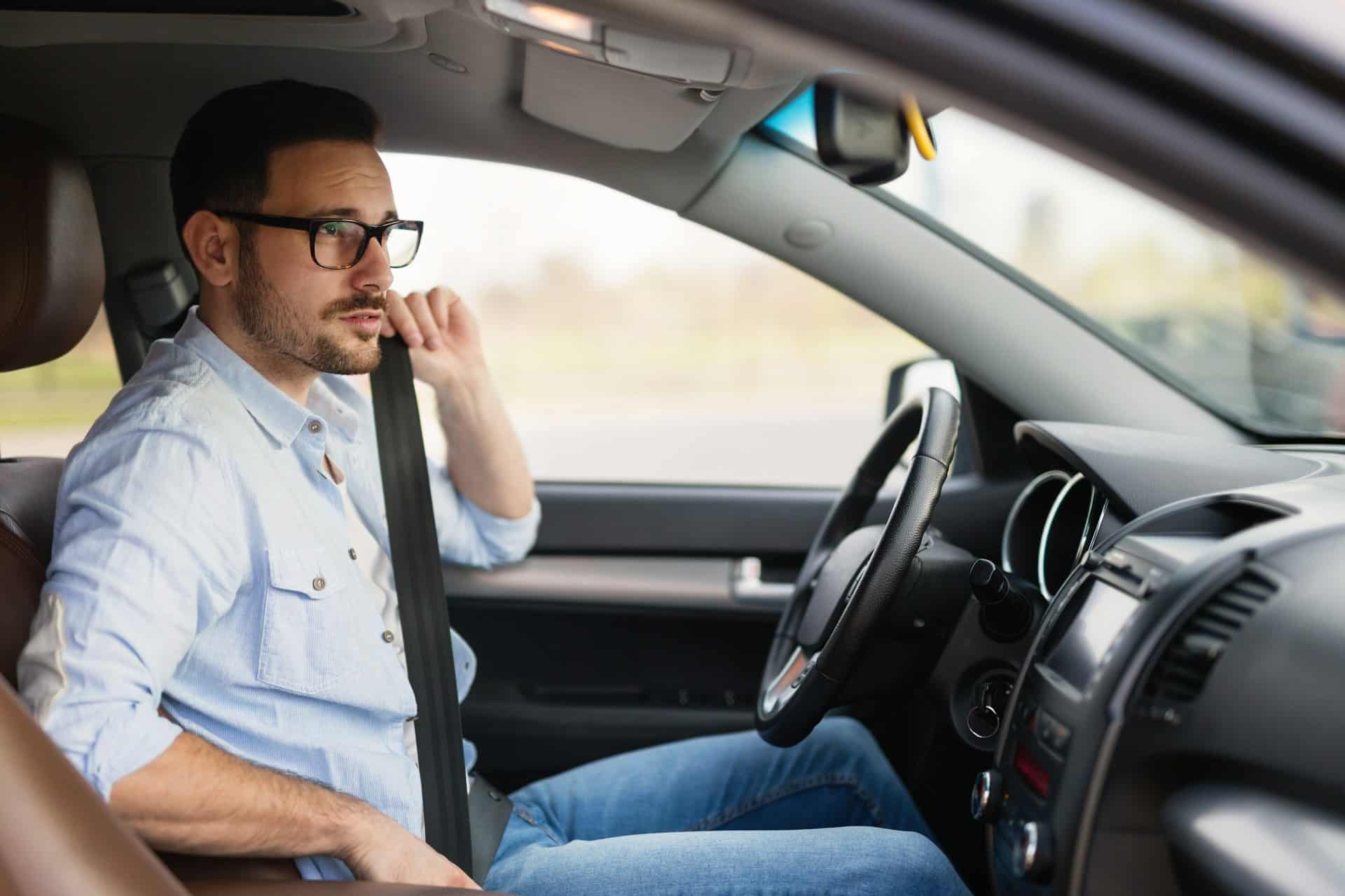 man inside car